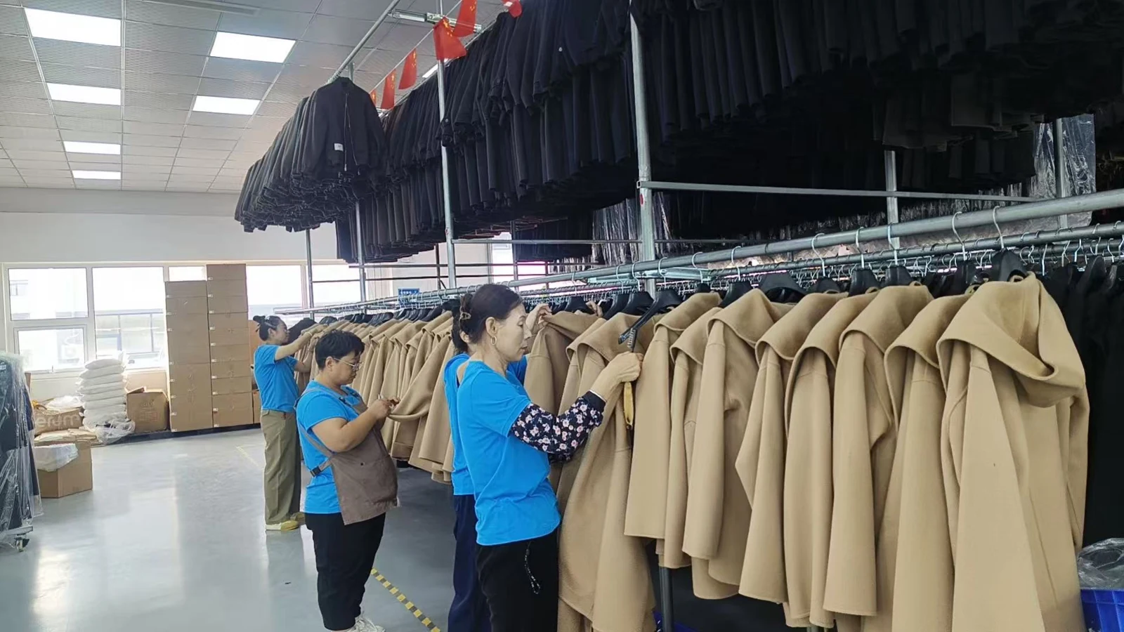 Team checking garments on rails